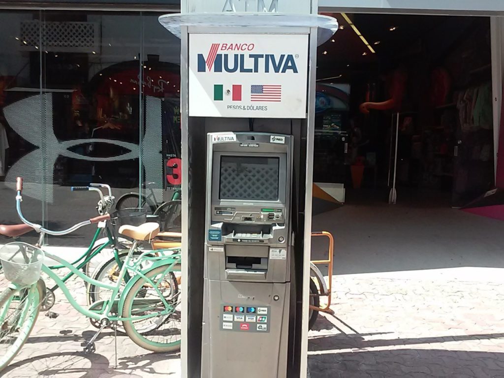 ATM stand-alone on a street.