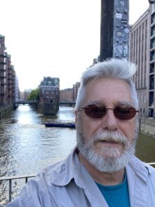 Don Herman standing at Instagram spot in Hamburg, looking bored.