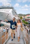 A young couple heading out for a grand day's adventure after booking their own excursions.