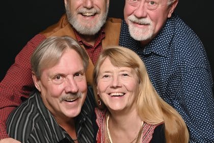 Don, Dwaine and friends dressed up for formal night on a cruise